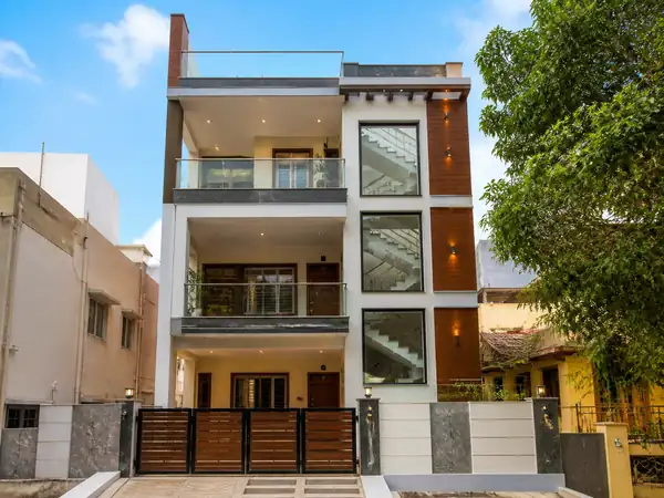 Modern residential exterior elevation design with clean lines and balcony details
